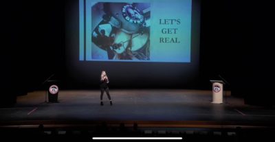 life-coach-slider person-on-stage-with-microphone